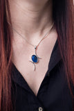  Model wearing Val B's Wax Sterling silver handcrafted pendant with blue cabochon hand-painted in wax  and sealed in glass