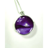 Purple stunning silver moon locket hand painted in bees wax and sealed in glass to create the perfect scene 