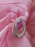 Light cerise scarf ring handpainted in wax and sealed in glass paired with a stylish light pink scarf 