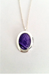 Beautiful purple oval pendant hand painted in bees wax and sealed in glass to make an amazing cabochon 