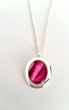Stunning cerise oval pendant stylish and simple but still beautiful hand painted in bees wax and sealed in glass 