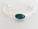 Fully adjustable jade wave bangle hand painted in wax and sealed in glass 