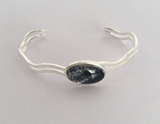 Shimmering grey wave bangle fully adjustable hand painted in wax and sealed in glass 