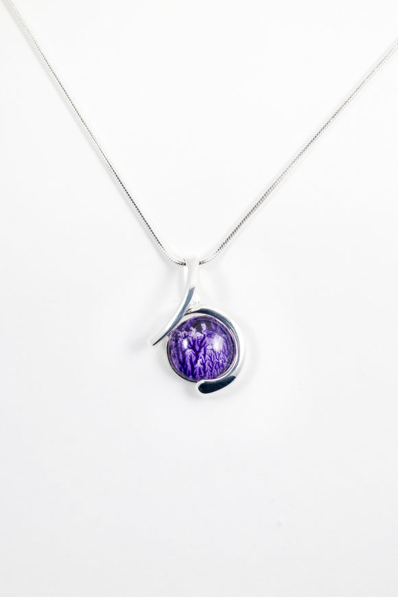 Circular swirl pendant purple handpainted in wax and sealed in glass 